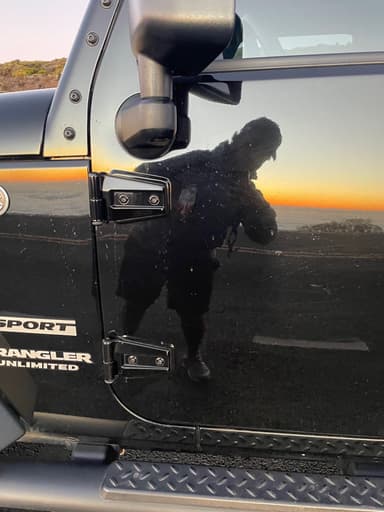 reflection of me in a shiny jeep